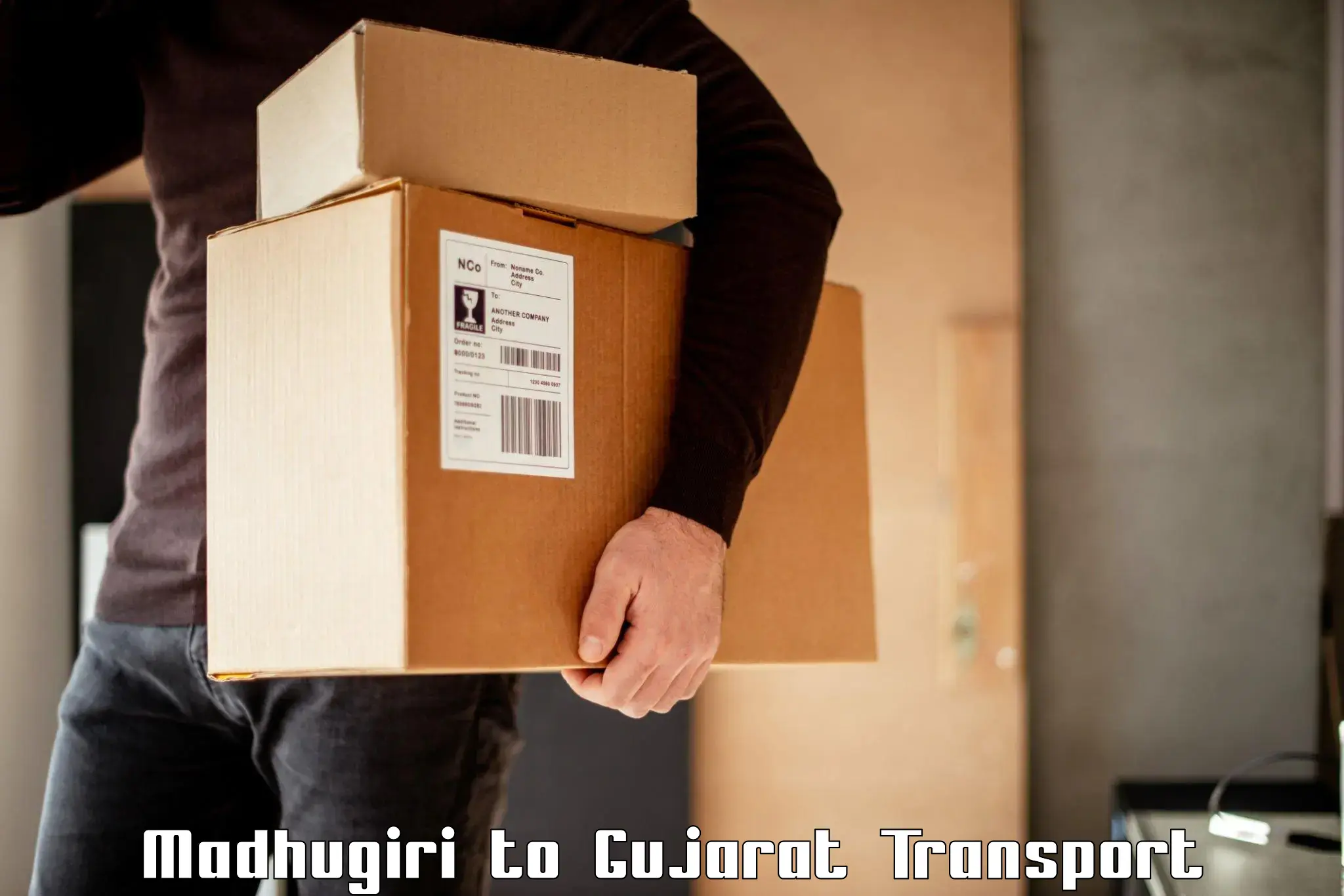 Bike shipping service Madhugiri to Halvad